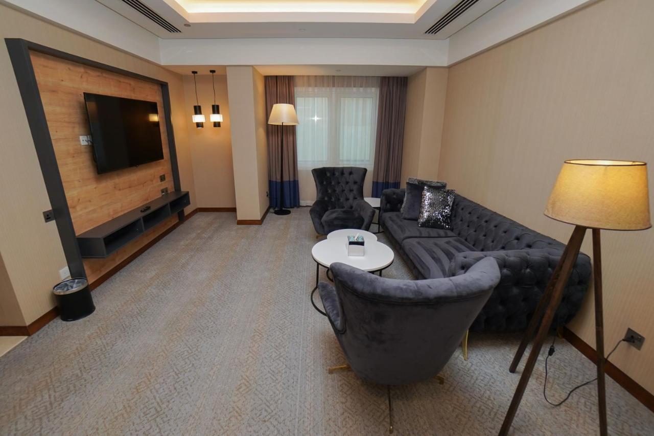 The Grand Lux Hotel Doha Eksteriør billede A living room in a hotel suite