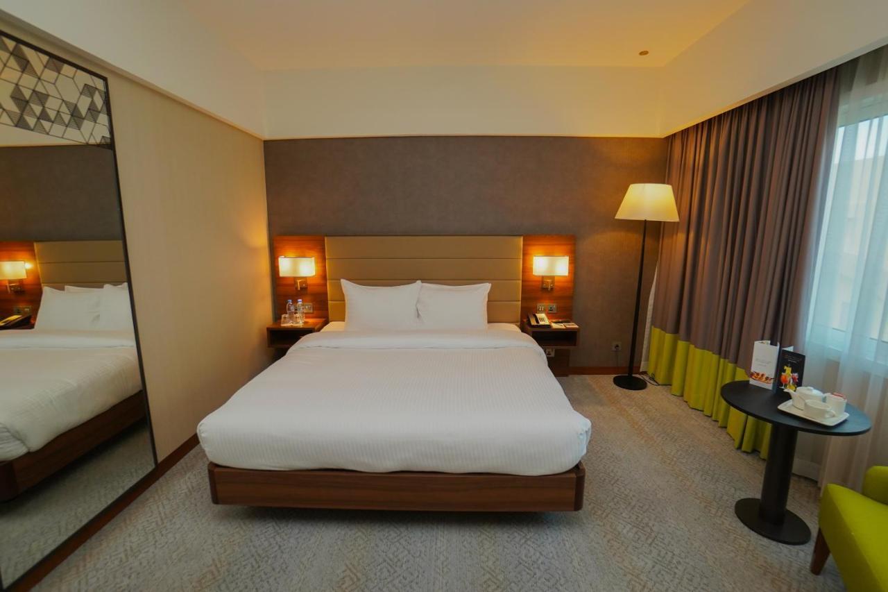 The Grand Lux Hotel Doha Eksteriør billede A room at the hotel