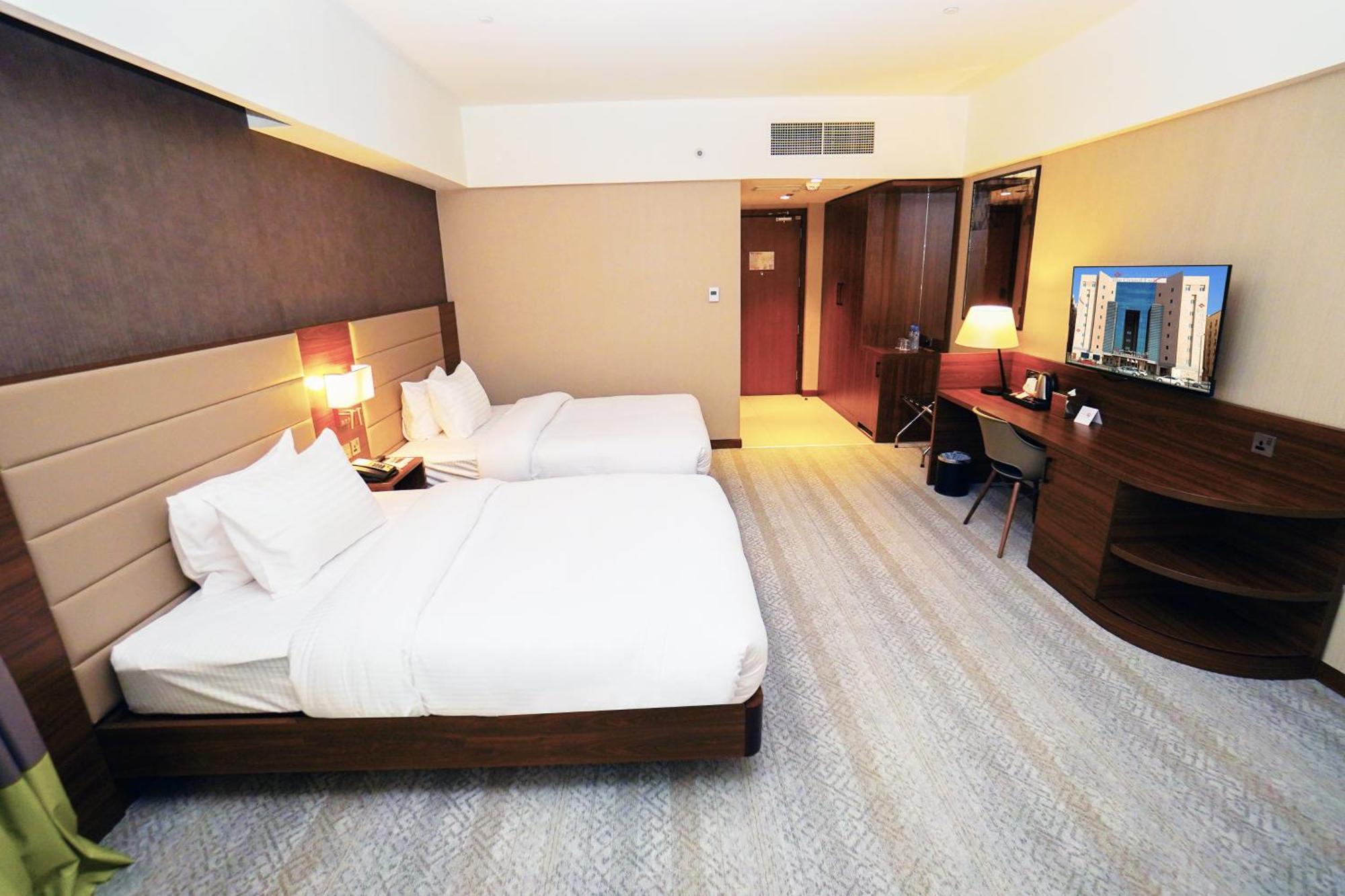 The Grand Lux Hotel Doha Eksteriør billede Deluxe Room